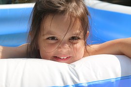 girl smiling in pool